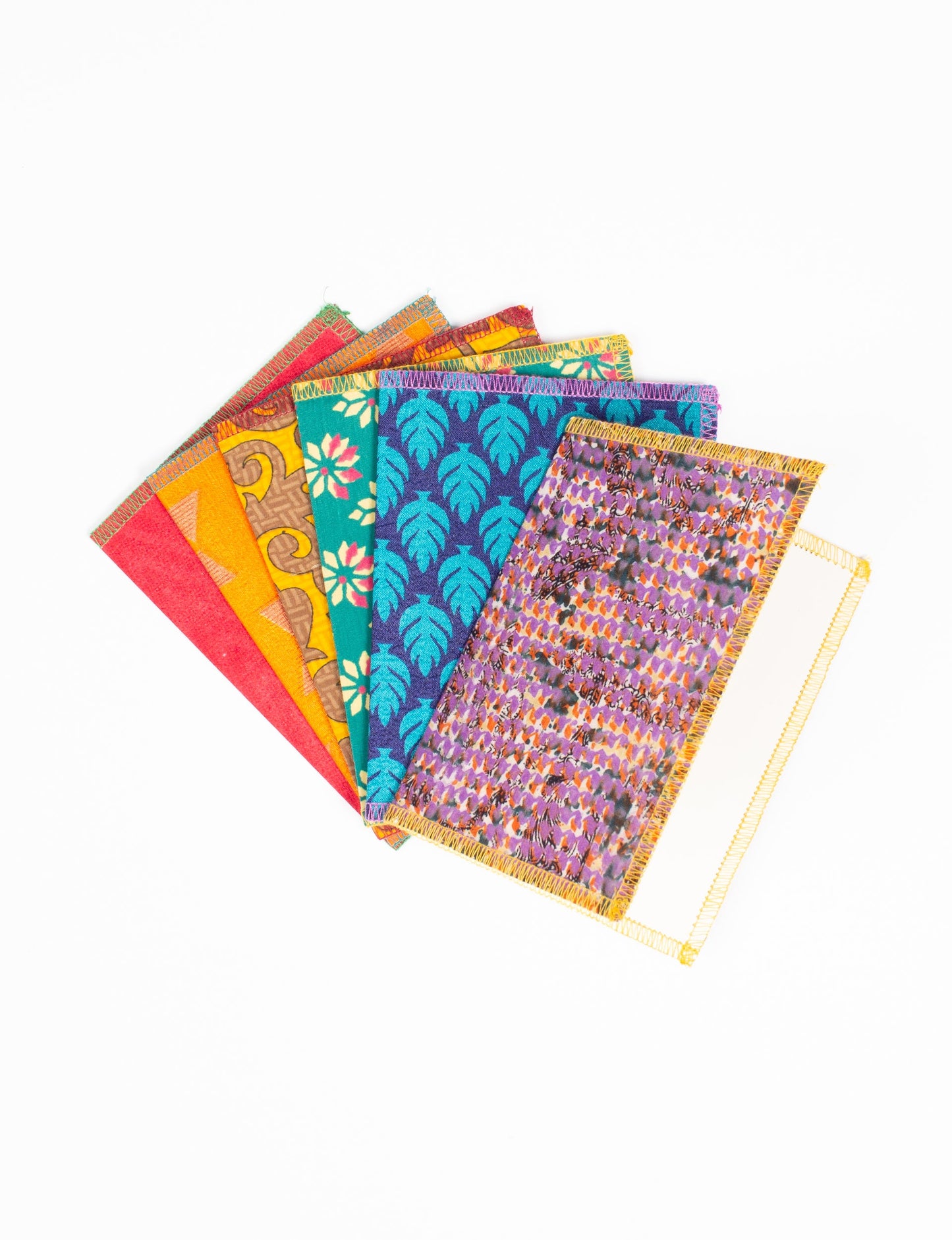 Folded Celebration Card Set, 6 pieces made from recycled sari fabric, showcasing sustainable, eco-friendly, and upcycled fashion principles. Ideal for sending wishes while supporting circular fashion, sustainable apparel, and environmentally friendly practices.