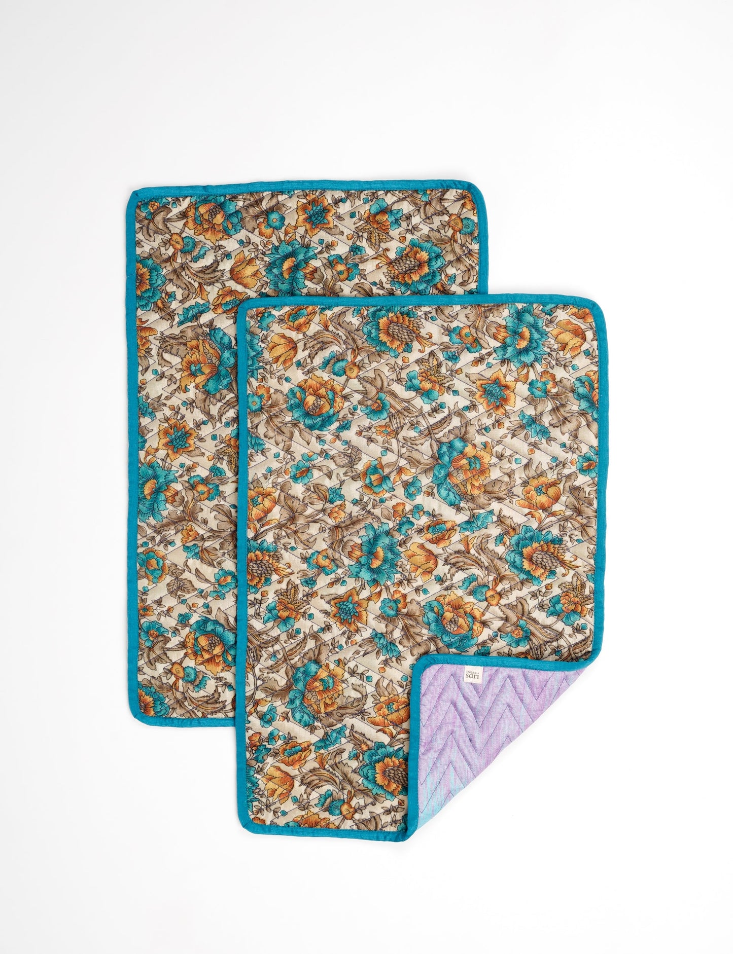 Quilted rectangular placement set of 2 made from upcycled saris and cotton canvas, eco-friendly dining accessories for ethical consumers.