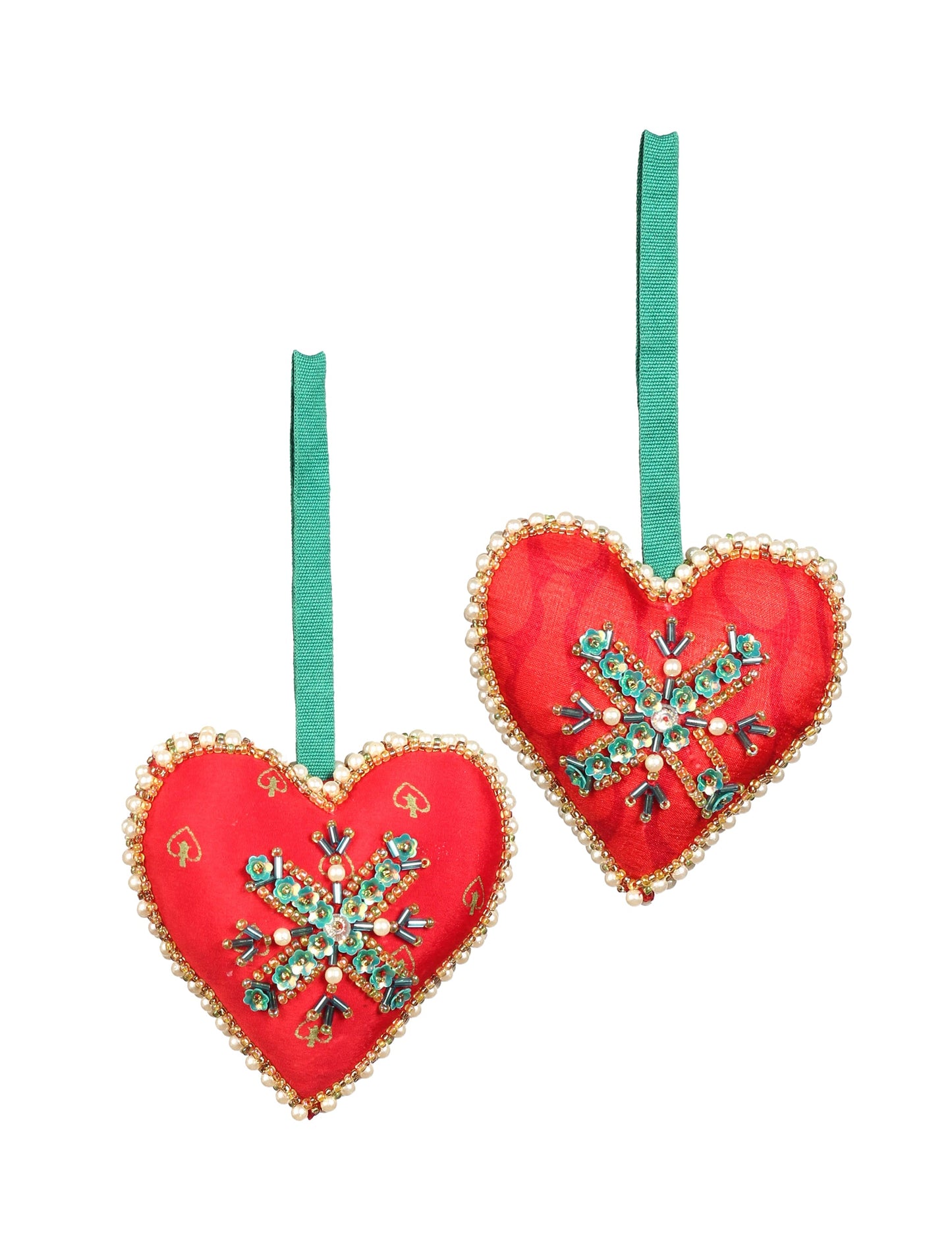 A Christmas heart ornament made from recycled sari fabric, featuring traditional Aari embroidery, representing sustainable, eco-friendly fashion. Handcrafted by artisans, this zero-waste, fair trade product symbolizes recycled material clothing and conscious clothing choices within eco-friendly and circular fashion.