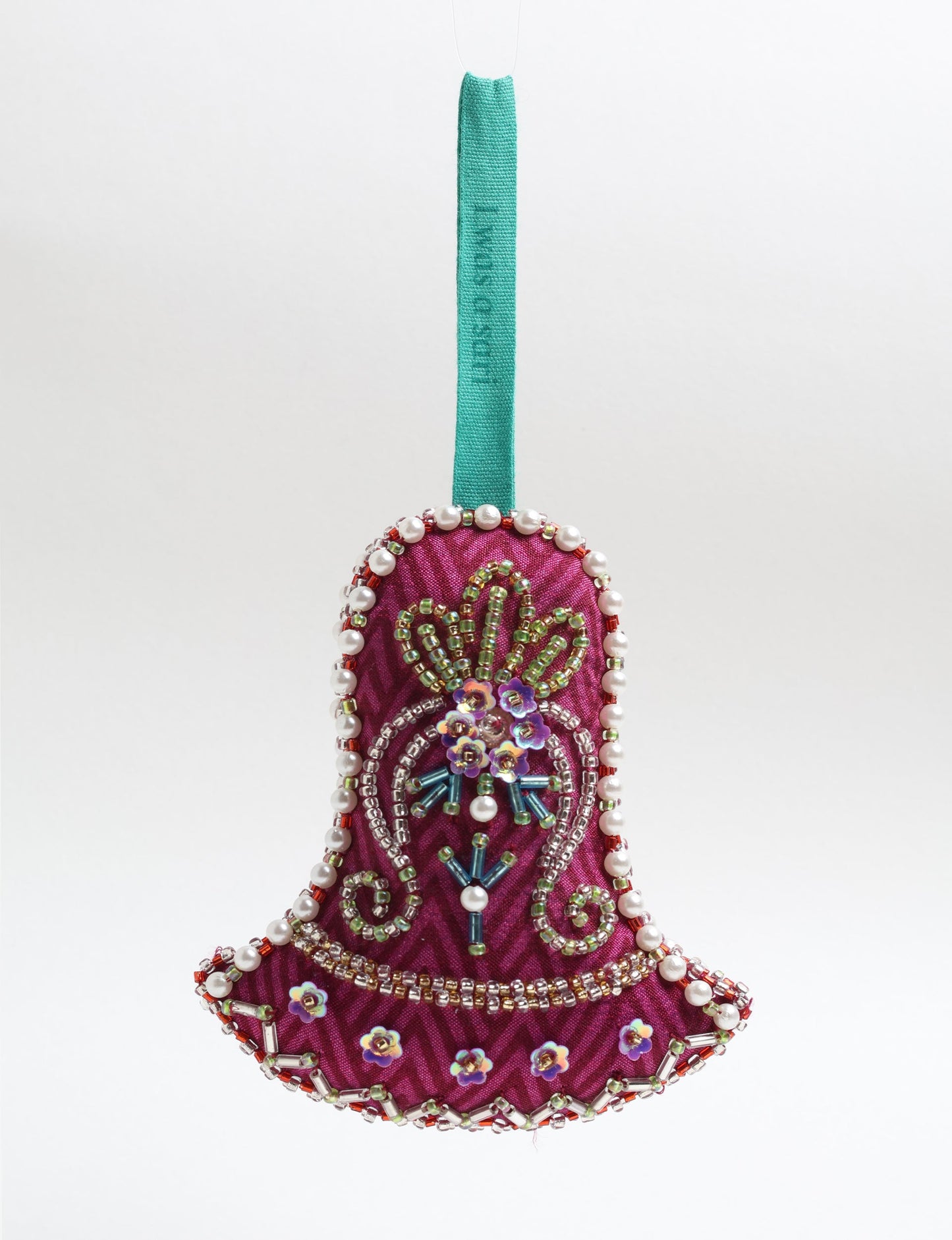 Bell-shaped Christmas ornament made from recycled saris, showcasing Aari embroidery, sustainable apparel, and green fashion. A celebration of upcycled clothing and eco-friendly products with a focus on sustainable women’s clothing and recycled fashion.