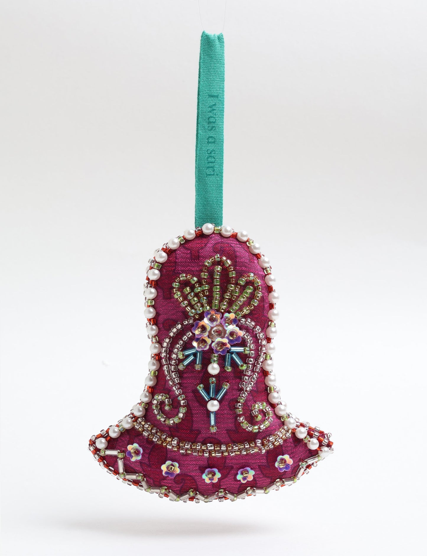 Bell-shaped Christmas ornament made from recycled saris, showcasing Aari embroidery, sustainable apparel, and green fashion. A celebration of upcycled clothing and eco-friendly products with a focus on sustainable women’s clothing and recycled fashion.