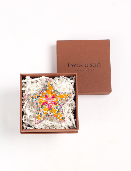 Christmas Star Ornaments made from upcycled saris with hand-embroidered Aari work, showcasing sustainable fashion and eco-friendly craftsmanship for ethical and green holiday decor.