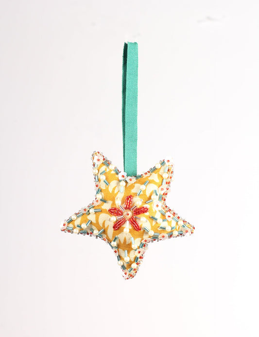 Christmas Star Ornaments made from upcycled saris with hand-embroidered Aari work, showcasing sustainable fashion and eco-friendly craftsmanship for ethical and green holiday decor.