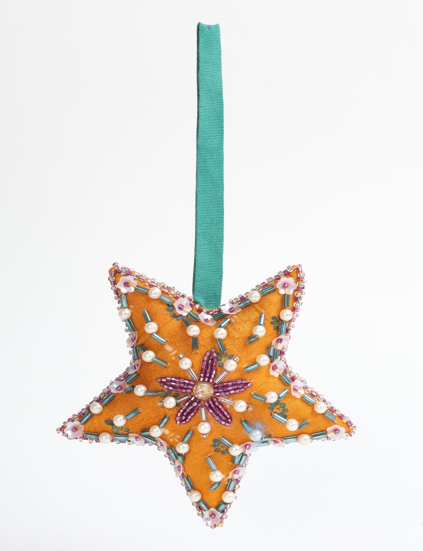 Christmas Star Ornaments made from upcycled saris with hand-embroidered Aari work, showcasing sustainable fashion and eco-friendly craftsmanship for ethical and green holiday decor.