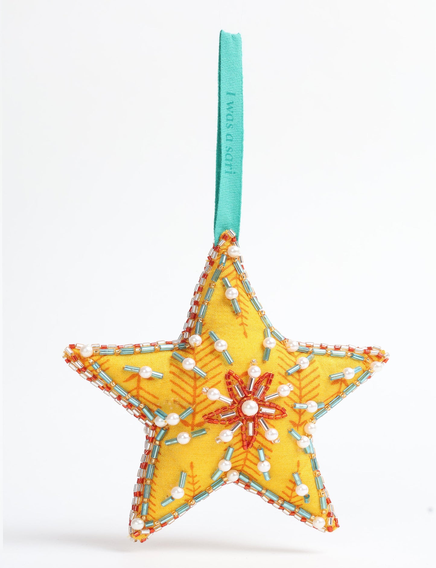 Christmas Star Ornaments made from upcycled saris with hand-embroidered Aari work, showcasing sustainable fashion and eco-friendly craftsmanship for ethical and green holiday decor.