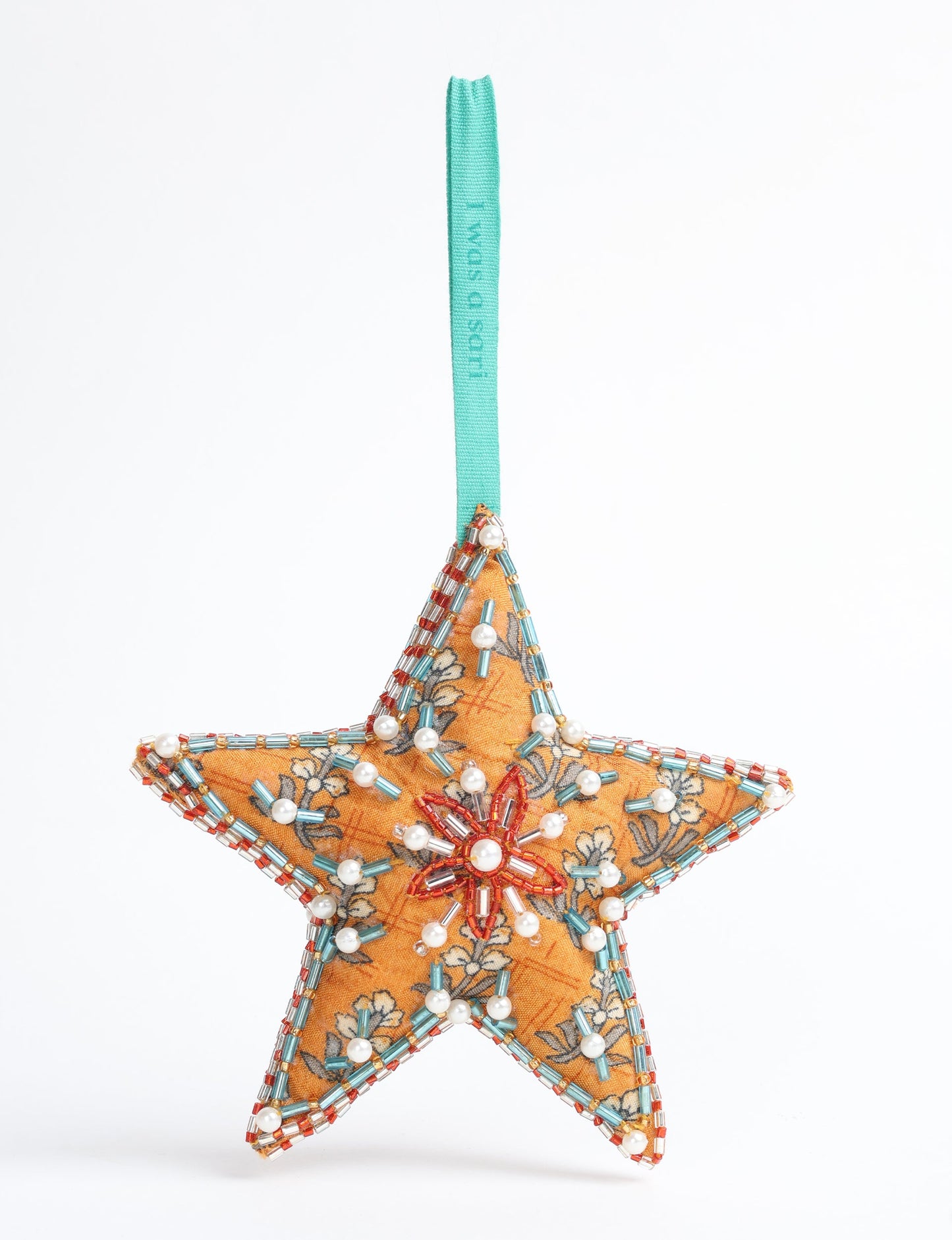 Christmas Star Ornaments made from upcycled saris with hand-embroidered Aari work, showcasing sustainable fashion and eco-friendly craftsmanship for ethical and green holiday decor.