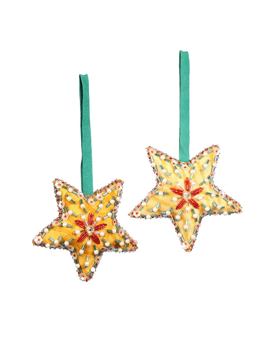 Christmas Star Ornaments made from upcycled saris with hand-embroidered Aari work, showcasing sustainable fashion and eco-friendly craftsmanship for ethical and green holiday decor.