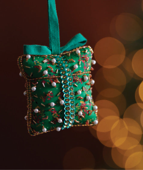 Eco-conscious Christmas ornament crafted from preloved saris, showcasing intricate Aari hand embroidery by female artisans. A beautiful, fair trade, upcycled decoration reflecting sustainable fashion, recycled materials, and ethical craftsmanship in green, earth-friendly, and circular fashion.