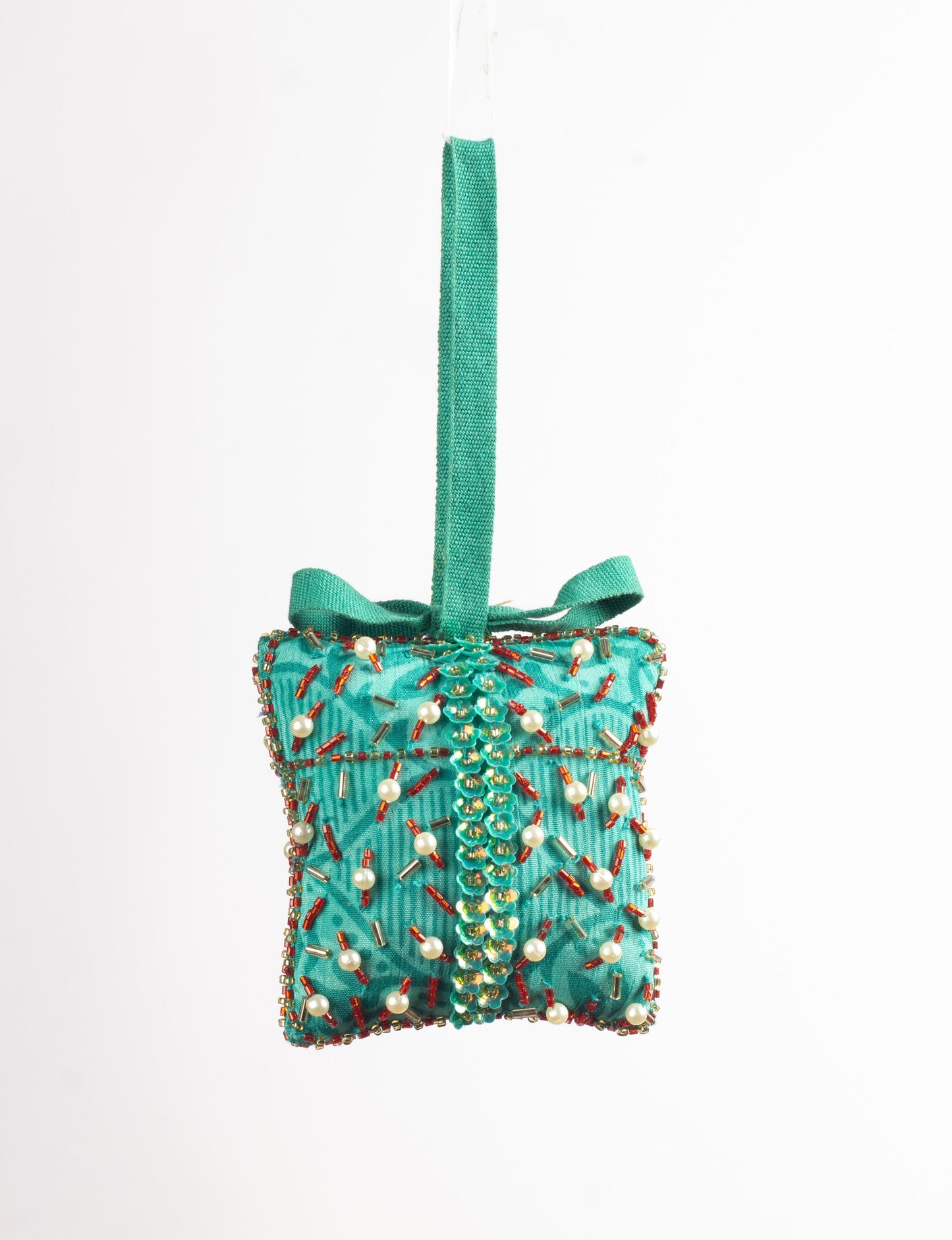 Eco-conscious Christmas ornament crafted from preloved saris, showcasing intricate Aari hand embroidery by female artisans. A beautiful, fair trade, upcycled decoration reflecting sustainable fashion, recycled materials, and ethical craftsmanship in green, earth-friendly, and circular fashion.