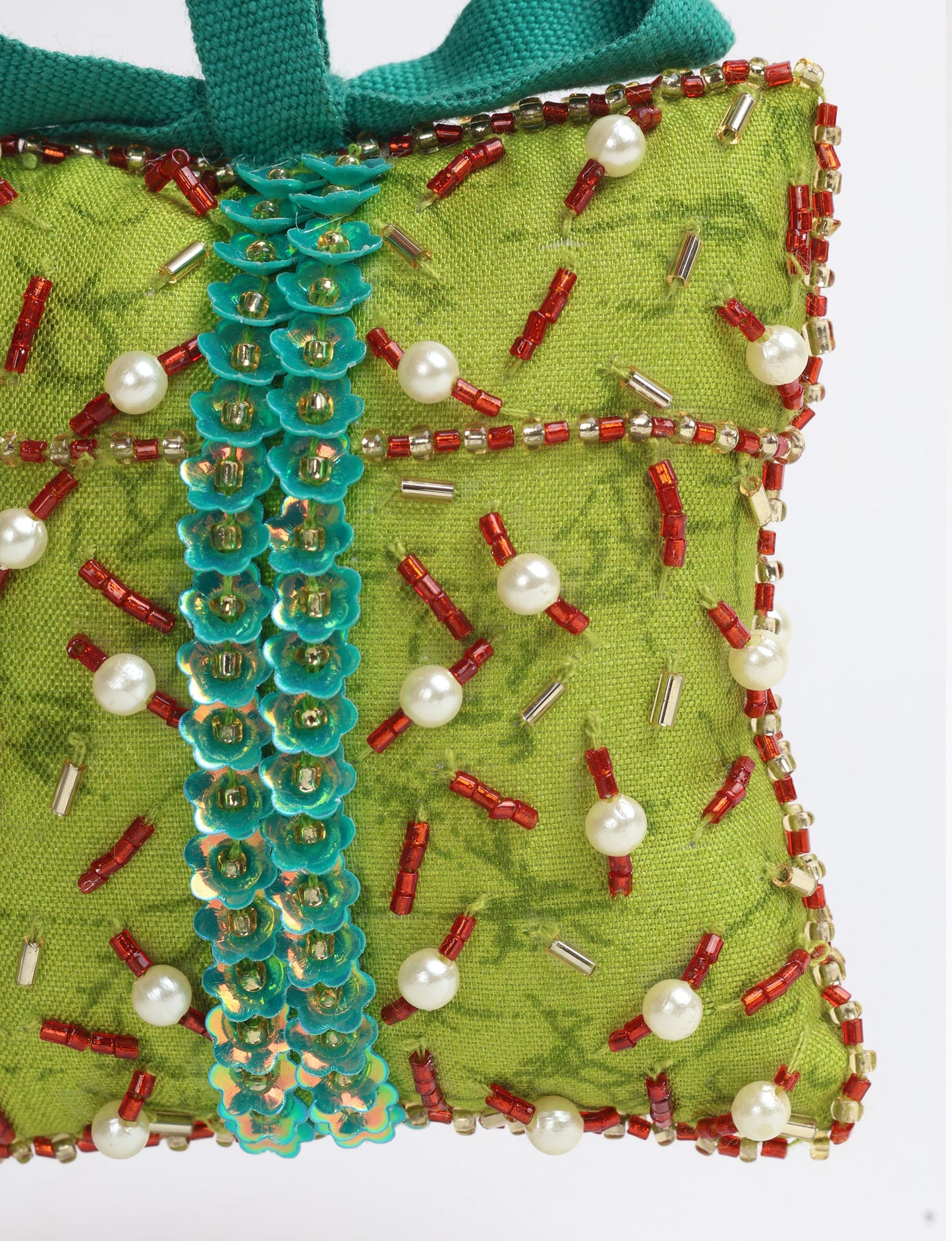 Eco-conscious Christmas ornament crafted from preloved saris, showcasing intricate Aari hand embroidery by female artisans. A beautiful, fair trade, upcycled decoration reflecting sustainable fashion, recycled materials, and ethical craftsmanship in green, earth-friendly, and circular fashion.