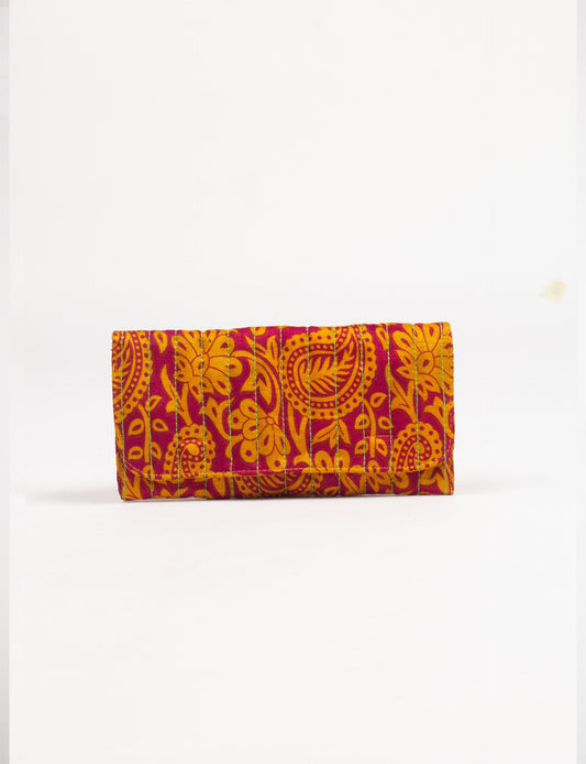 Quilted sunglasses case made from recycled sari products, featuring a secure magnetic closure. A chic example of ethical fashion, conscious clothing, and carbon neutral fashion. Protect your sunglasses while embracing circular fashion and upcycled garments.