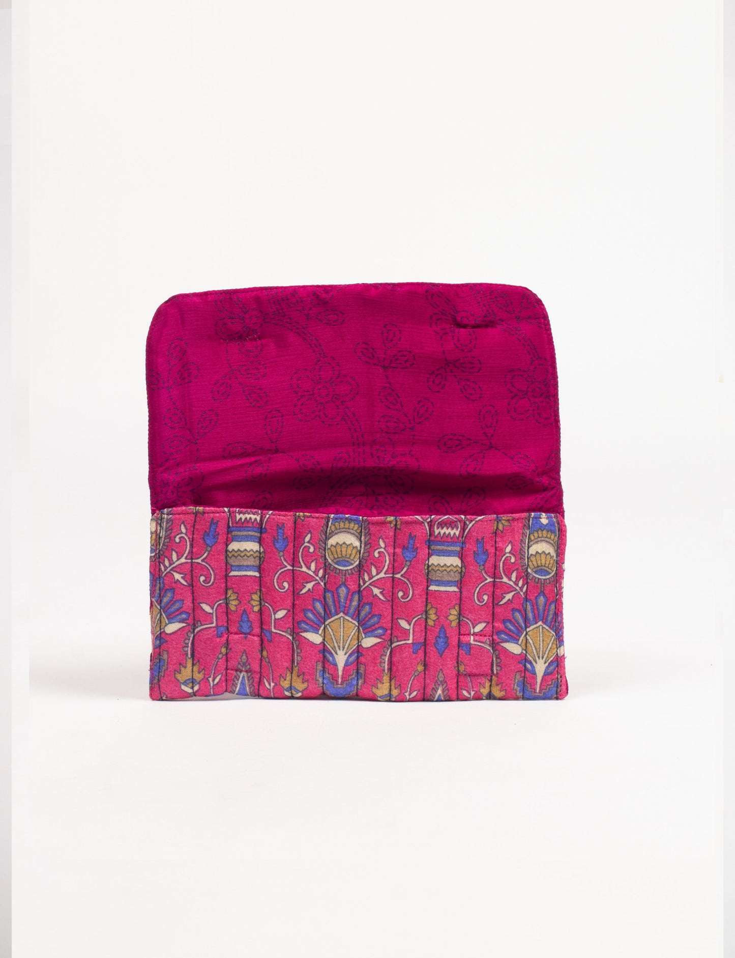 Quilted sunglasses case made from recycled sari products, featuring a secure magnetic closure. A chic example of ethical fashion, conscious clothing, and carbon neutral fashion. Protect your sunglasses while embracing circular fashion and upcycled garments.