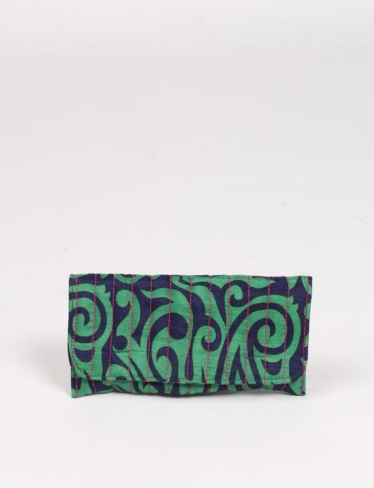 Quilted sunglasses case made from recycled sari products, featuring a secure magnetic closure. A chic example of ethical fashion, conscious clothing, and carbon neutral fashion. Protect your sunglasses while embracing circular fashion and upcycled garments.