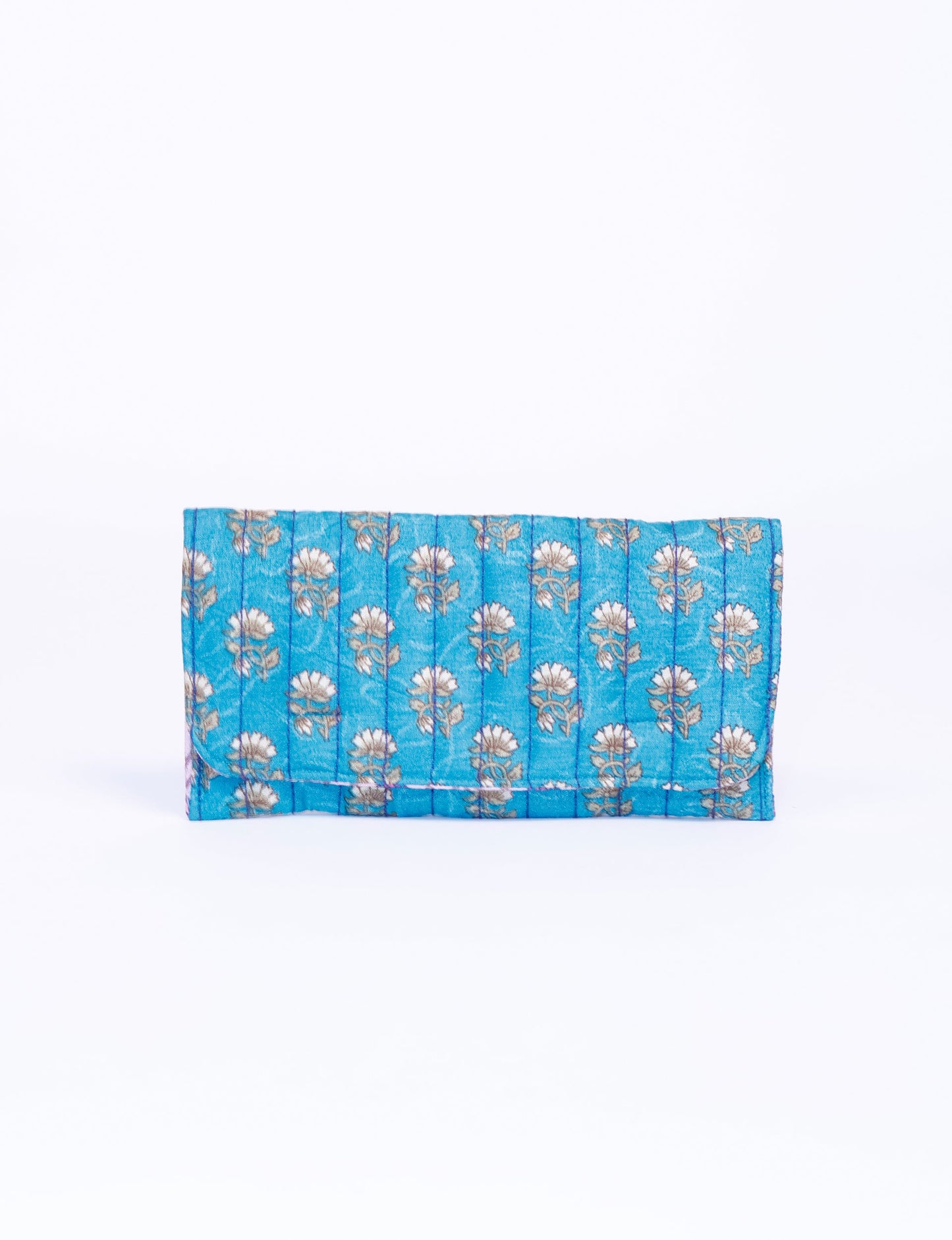 Quilted sunglasses case made from recycled sari products, featuring a secure magnetic closure. A chic example of ethical fashion, conscious clothing, and carbon neutral fashion. Protect your sunglasses while embracing circular fashion and upcycled garments.