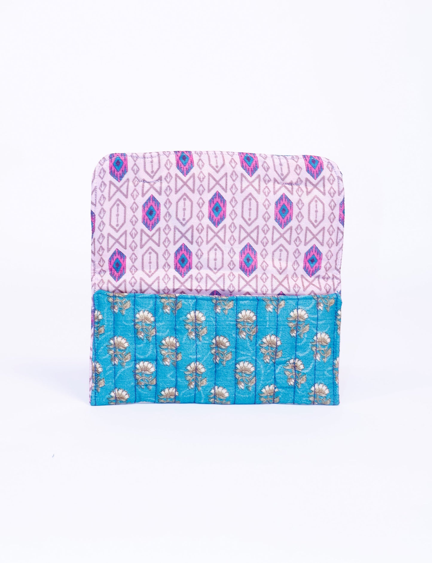 Quilted sunglasses case made from recycled sari products, featuring a secure magnetic closure. A chic example of ethical fashion, conscious clothing, and carbon neutral fashion. Protect your sunglasses while embracing circular fashion and upcycled garments.