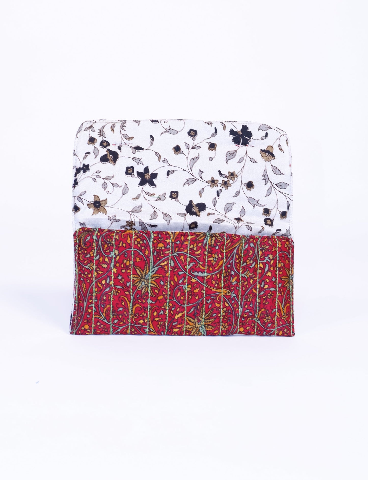 Quilted sunglasses case made from recycled sari products, featuring a secure magnetic closure. A chic example of ethical fashion, conscious clothing, and carbon neutral fashion. Protect your sunglasses while embracing circular fashion and upcycled garments.