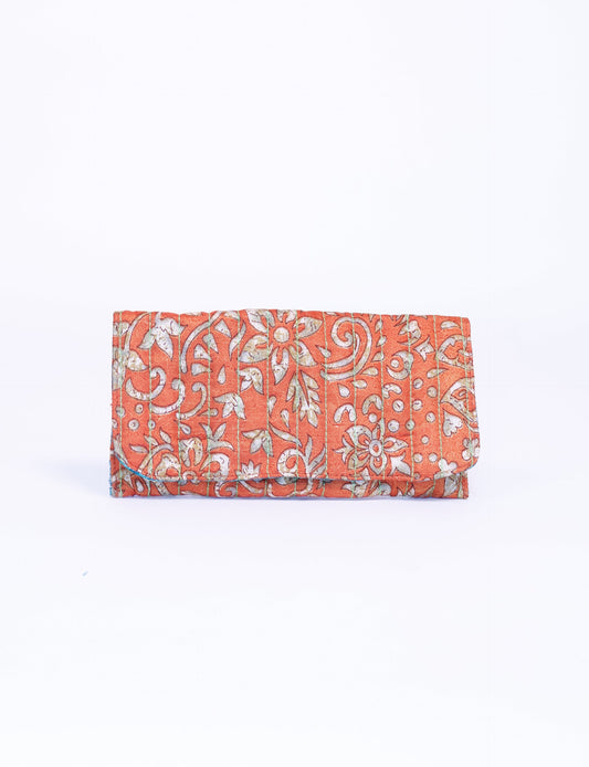 Quilted sunglasses case made from recycled sari products, featuring a secure magnetic closure. A chic example of ethical fashion, conscious clothing, and carbon neutral fashion. Protect your sunglasses while embracing circular fashion and upcycled garments.