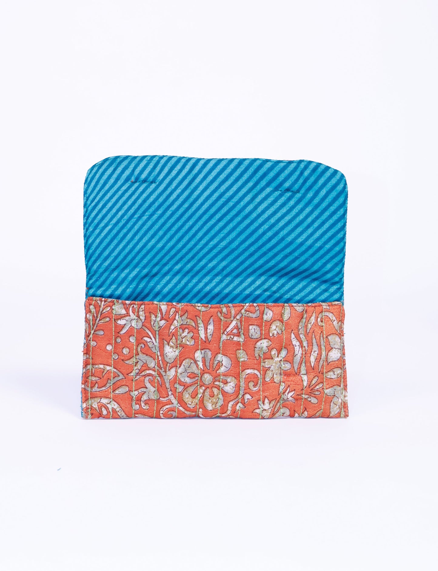 Quilted sunglasses case made from recycled sari products, featuring a secure magnetic closure. A chic example of ethical fashion, conscious clothing, and carbon neutral fashion. Protect your sunglasses while embracing circular fashion and upcycled garments.