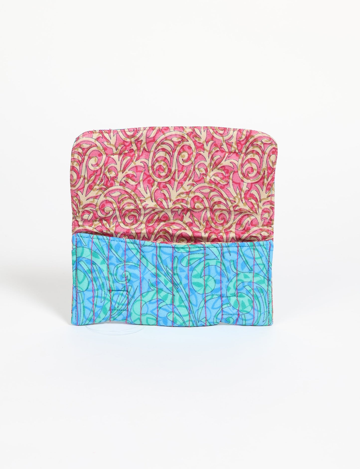 Quilted sunglasses case made from recycled sari products, featuring a secure magnetic closure. A chic example of ethical fashion, conscious clothing, and carbon neutral fashion. Protect your sunglasses while embracing circular fashion and upcycled garments.