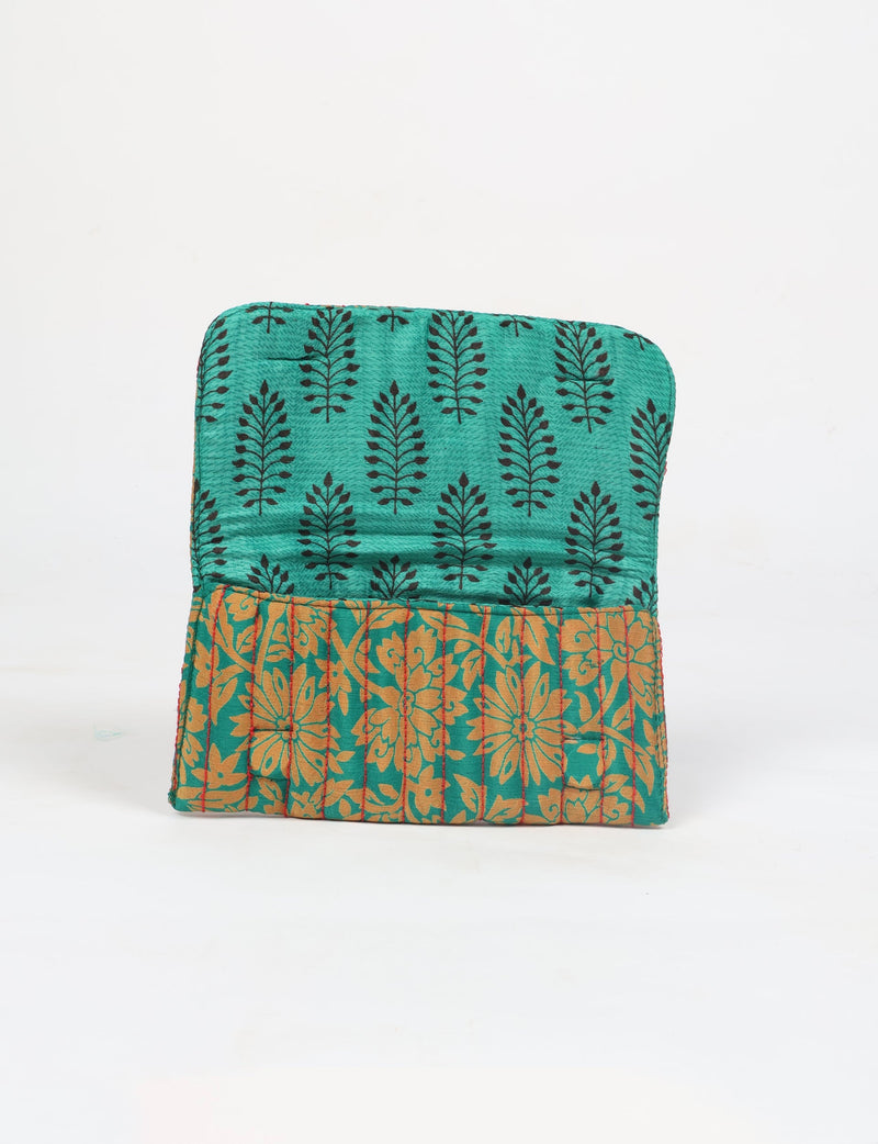 Quilted sunglasses case made from recycled sari products, featuring a secure magnetic closure. A chic example of ethical fashion, conscious clothing, and carbon neutral fashion. Protect your sunglasses while embracing circular fashion and upcycled garments.