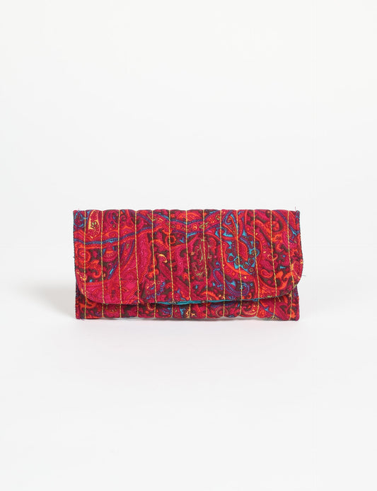 Quilted sunglasses case made from recycled sari products, featuring a secure magnetic closure. A chic example of ethical fashion, conscious clothing, and carbon neutral fashion. Protect your sunglasses while embracing circular fashion and upcycled garments.