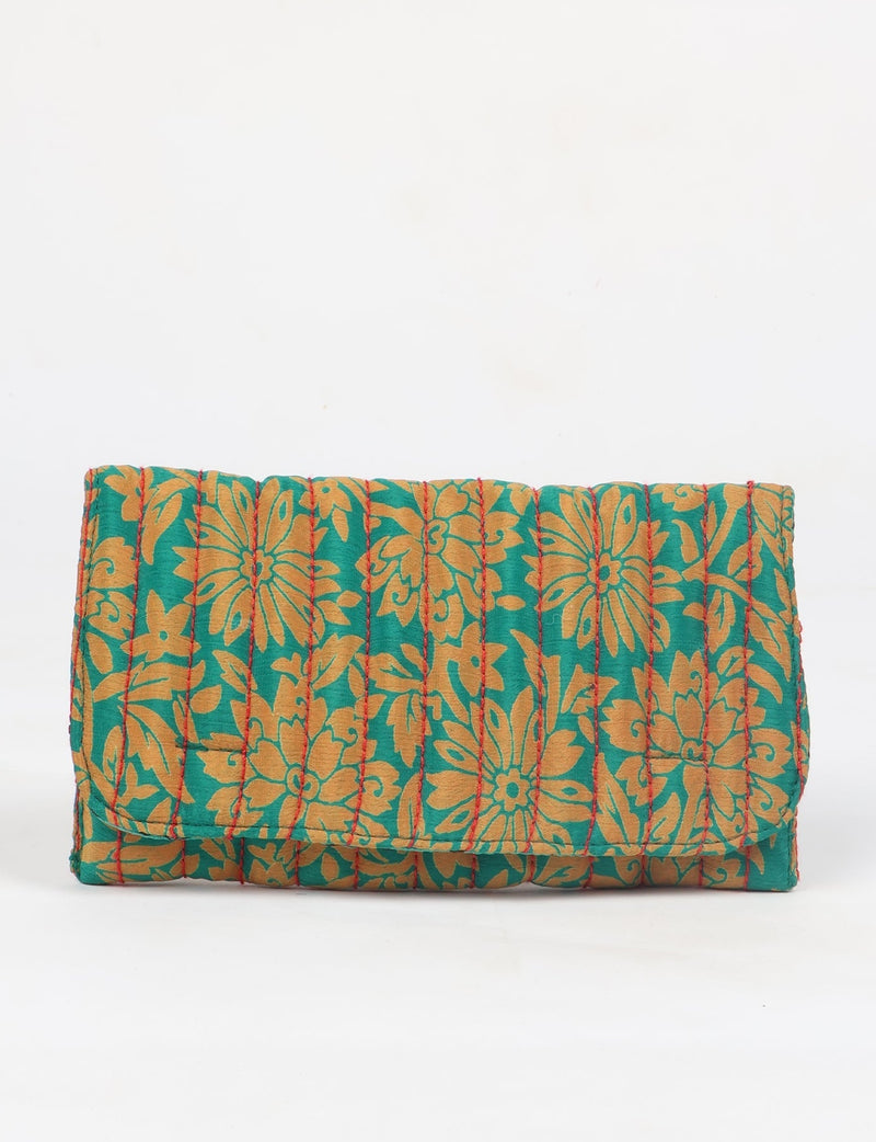 Quilted sunglasses case made from recycled sari products, featuring a secure magnetic closure. A chic example of ethical fashion, conscious clothing, and carbon neutral fashion. Protect your sunglasses while embracing circular fashion and upcycled garments.