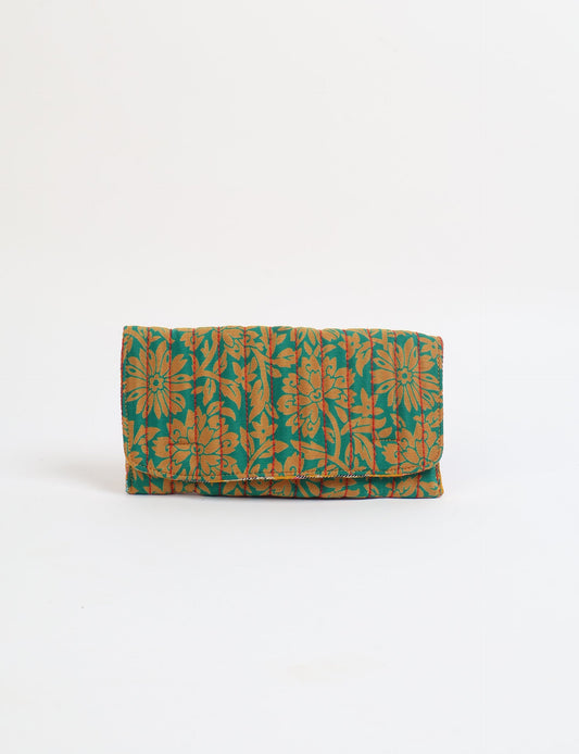 Quilted sunglasses case made from recycled sari products, featuring a secure magnetic closure. A chic example of ethical fashion, conscious clothing, and carbon neutral fashion. Protect your sunglasses while embracing circular fashion and upcycled garments.