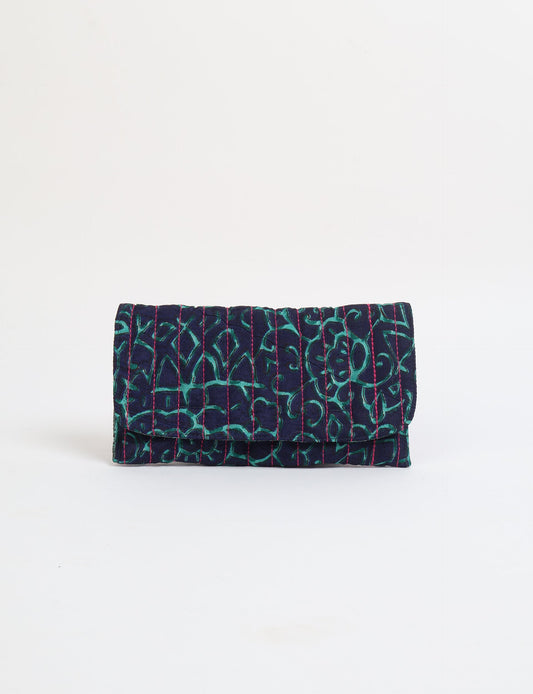 Quilted sunglasses case made from recycled sari products, featuring a secure magnetic closure. A chic example of ethical fashion, conscious clothing, and carbon neutral fashion. Protect your sunglasses while embracing circular fashion and upcycled garments.