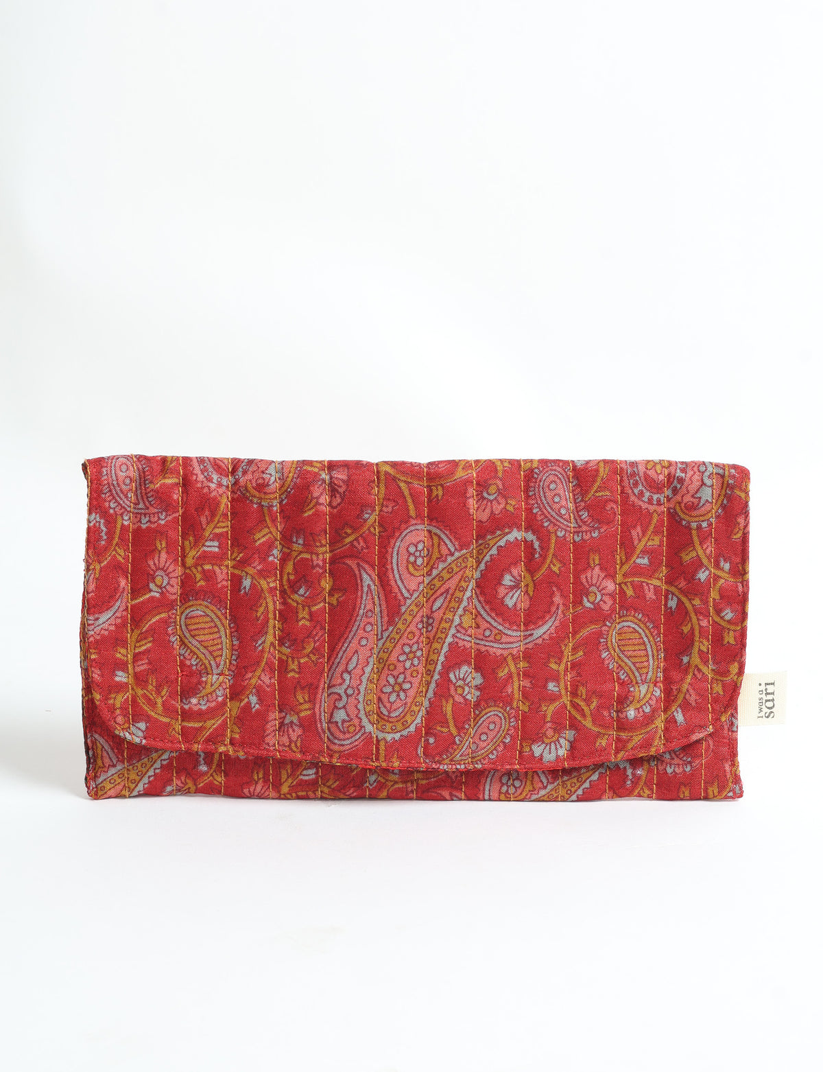 Quilted red paisley fabric sunglasses case with vertical stitching and a small white label on the side