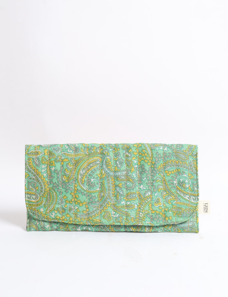 Quilted sunglasses case in green paisley pattern with yellow and gray accents, folded flat with visible fabric texture and