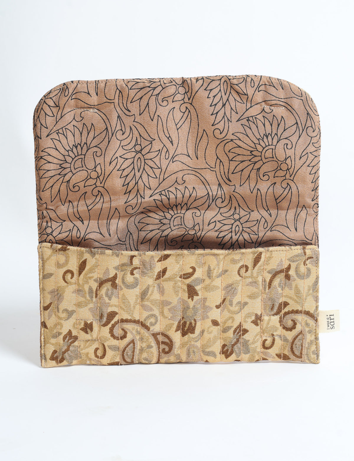 Beige quilted sunglasses case with tropical floral pattern, open flat showing inner and outer fabric designs and label tag