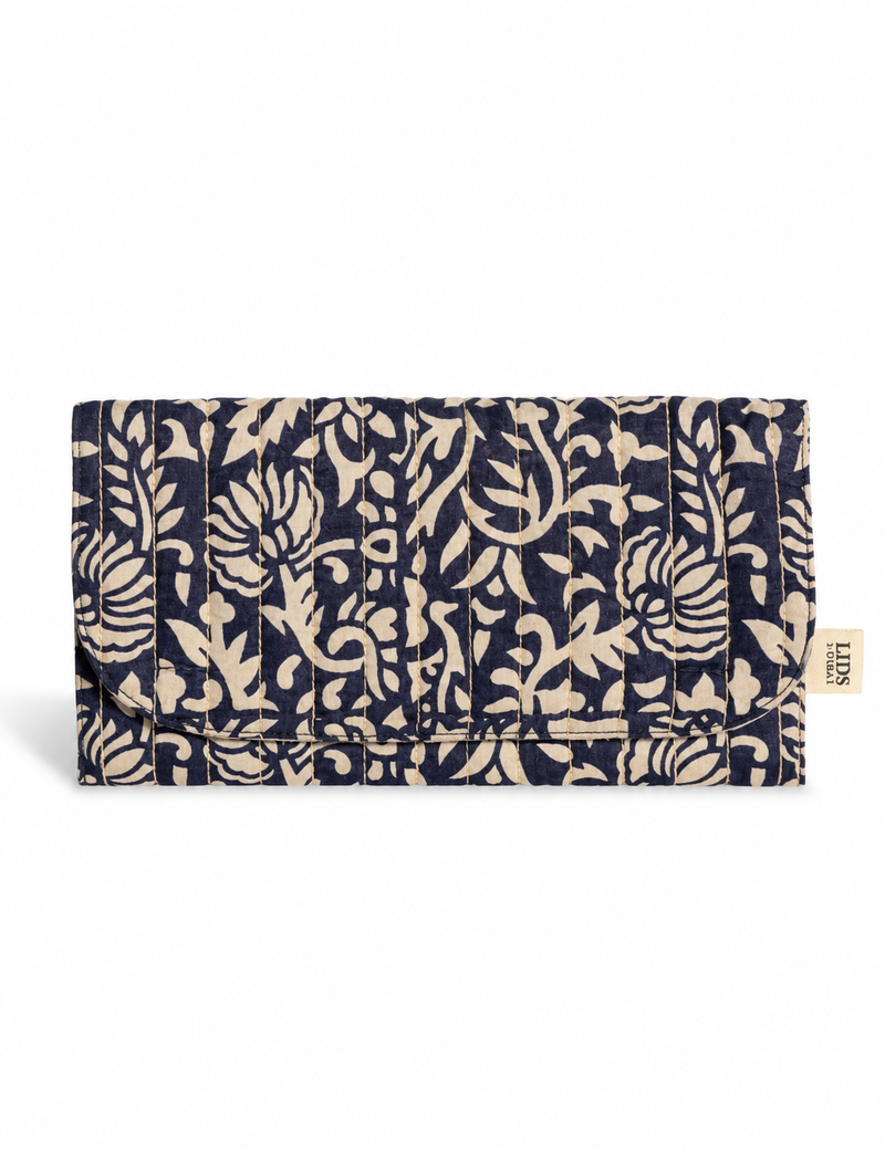 Quilted sunglasses case made from recycled sari products, featuring a secure magnetic closure. A chic example of ethical fashion, conscious clothing, and carbon neutral fashion. Protect your sunglasses while embracing circular fashion and upcycled garments.