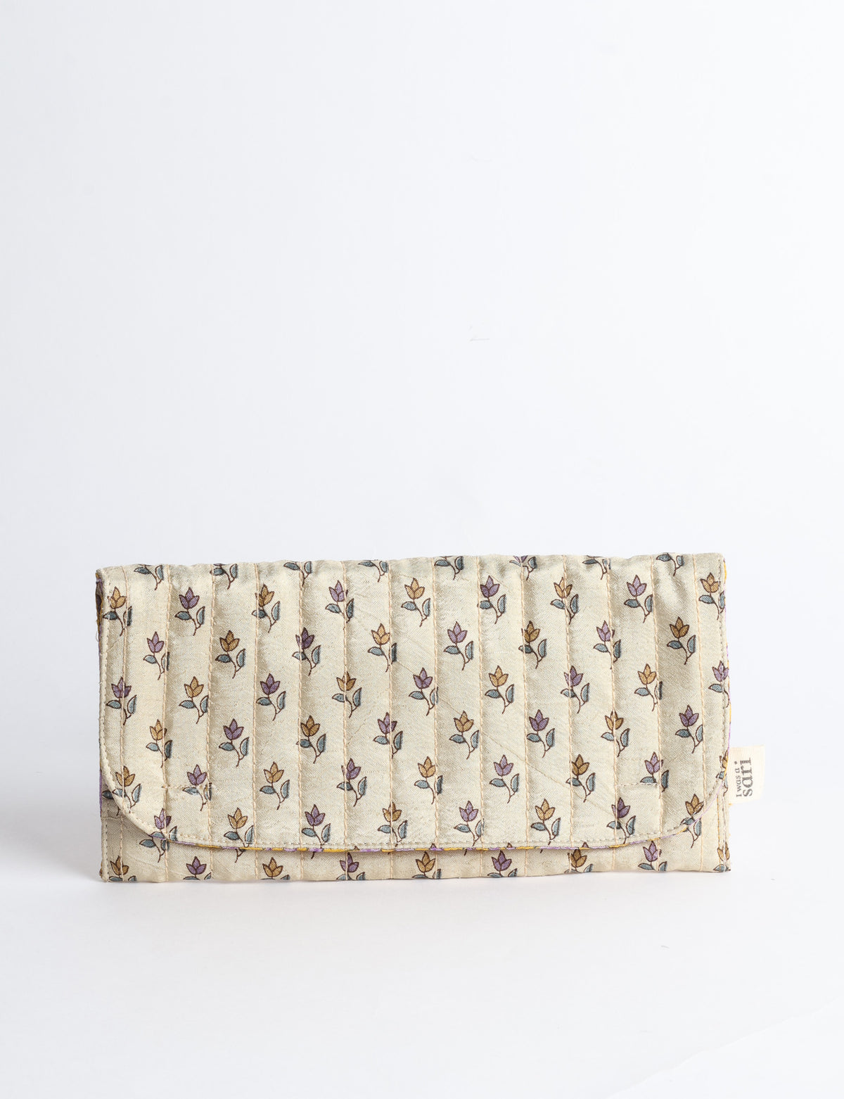 Quilted sunglasses case made from recycled sari products, featuring a secure magnetic closure. A chic example of ethical fashion, conscious clothing, and carbon neutral fashion. Protect your sunglasses while embracing circular fashion and upcycled garments.