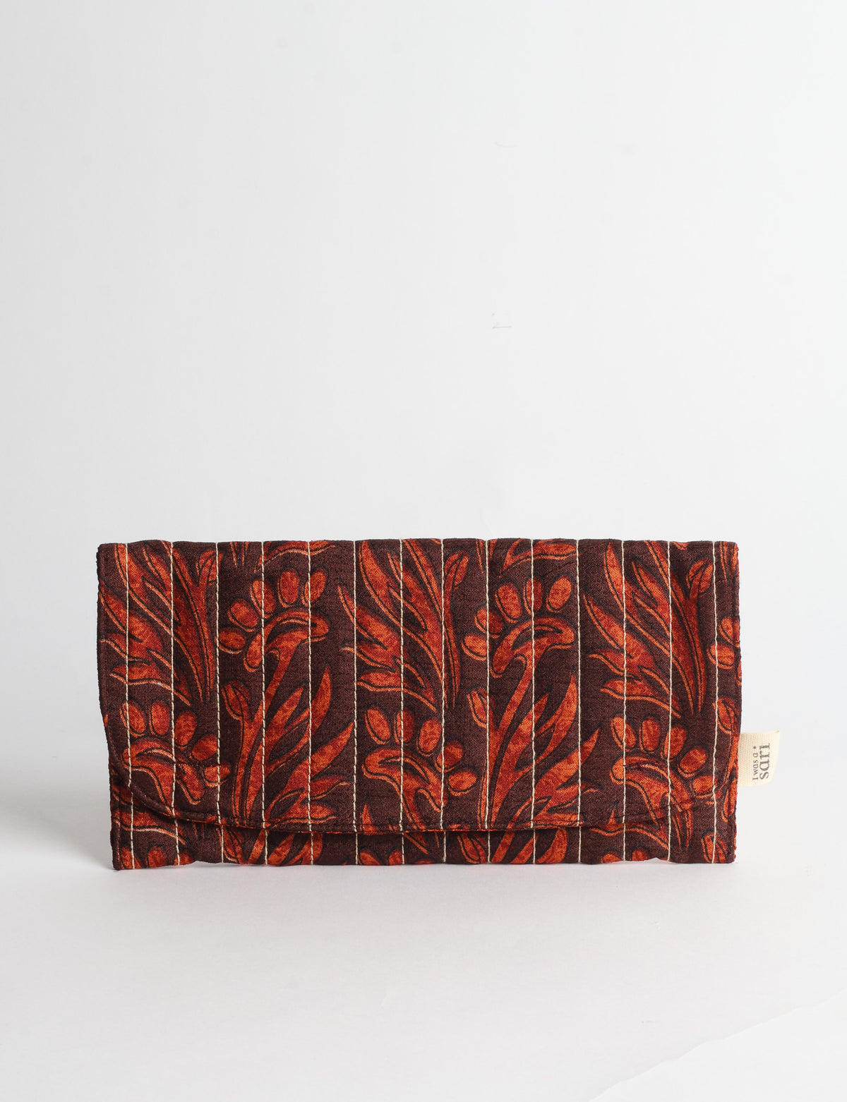 Quilted sunglasses case made from recycled sari products, featuring a secure magnetic closure. A chic example of ethical fashion, conscious clothing, and carbon neutral fashion. Protect your sunglasses while embracing circular fashion and upcycled garments.