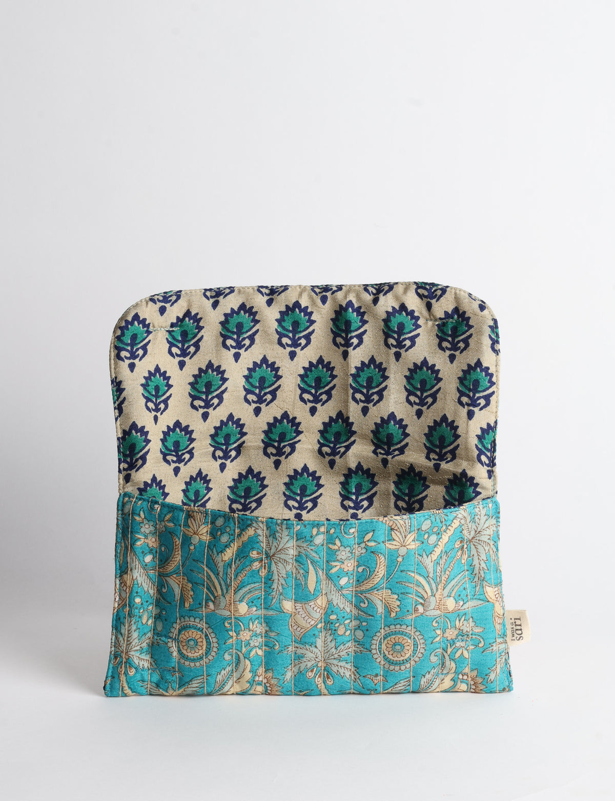Quilted sunglasses case made from recycled sari products, featuring a secure magnetic closure. A chic example of ethical fashion, conscious clothing, and carbon neutral fashion. Protect your sunglasses while embracing circular fashion and upcycled garments.