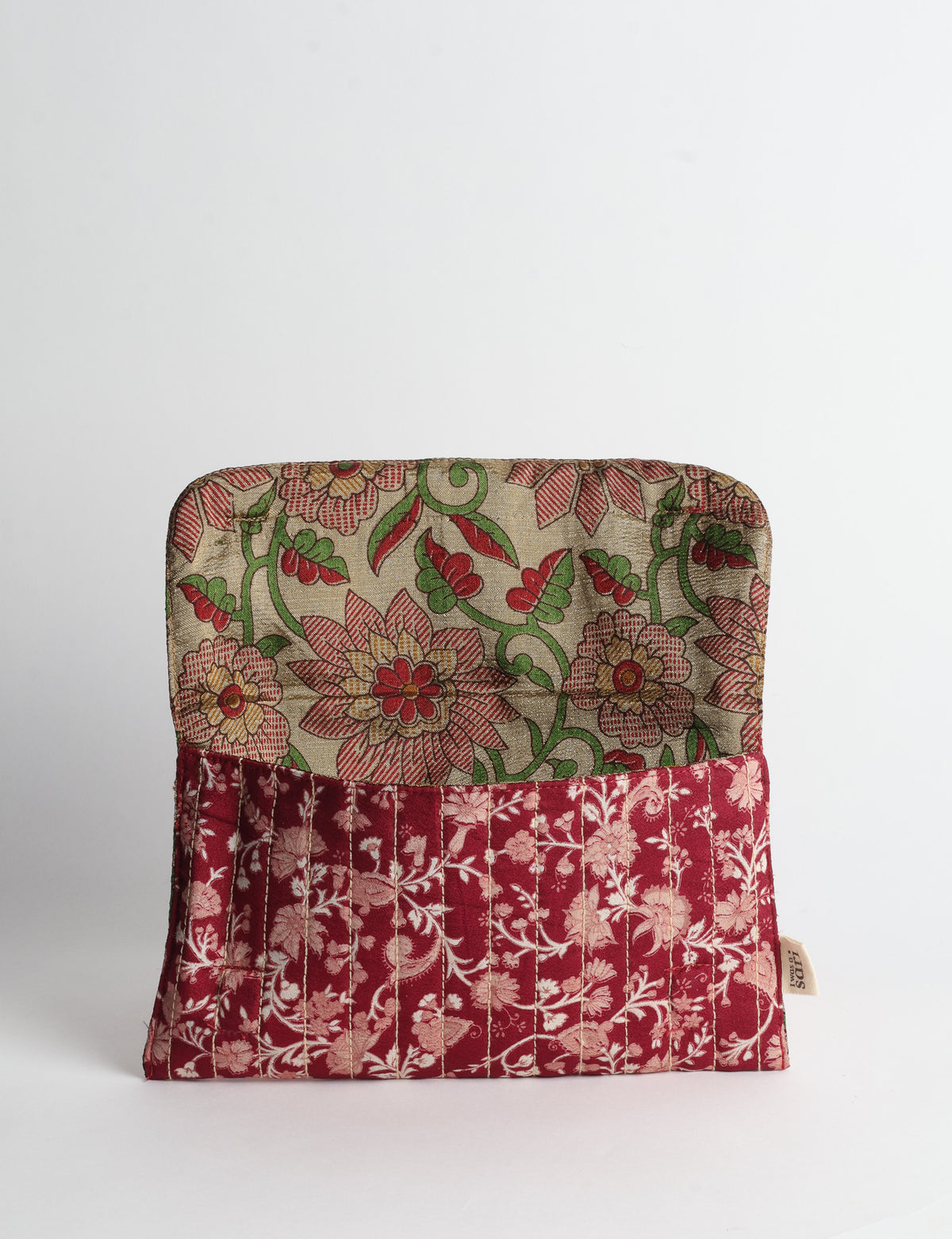 Quilted sunglasses case made from recycled sari products, featuring a secure magnetic closure. A chic example of ethical fashion, conscious clothing, and carbon neutral fashion. Protect your sunglasses while embracing circular fashion and upcycled garments.