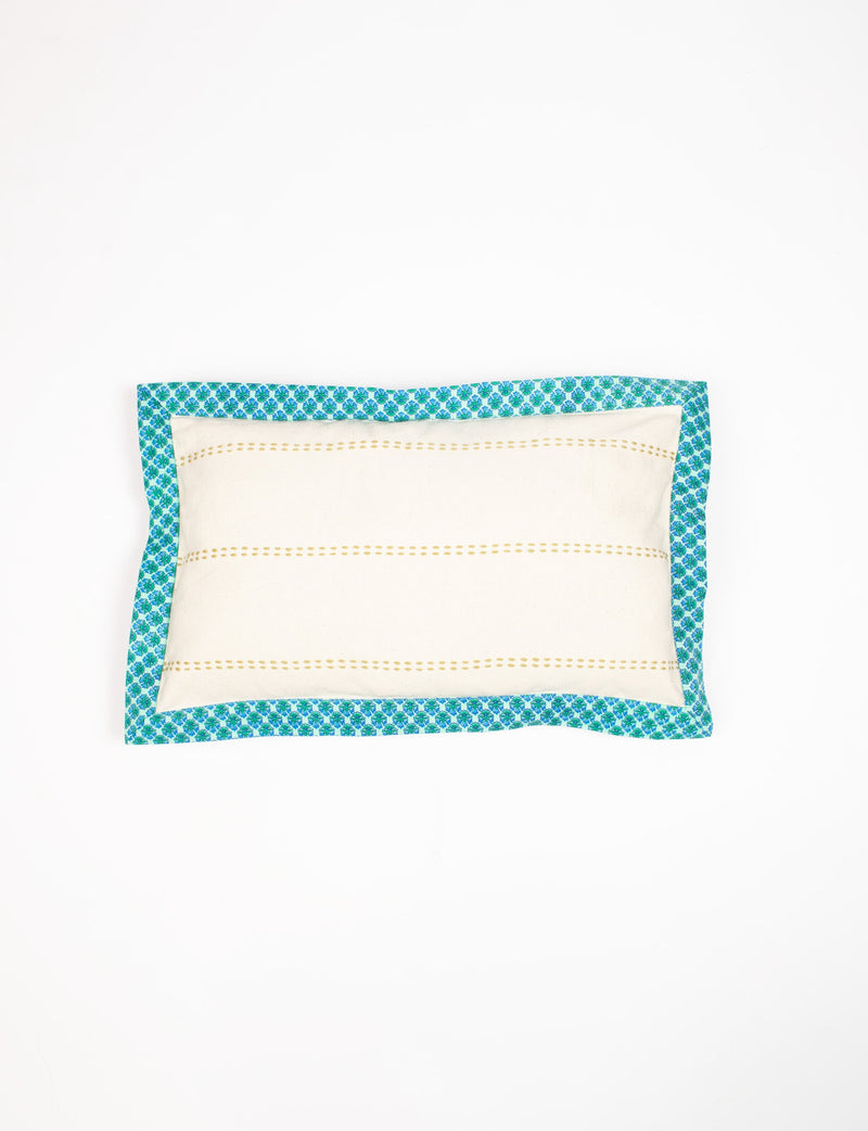 Rectangular lumbar cotton cushion cover with cream center, yellow dotted stripes, and blue floral sari edging, flat lay view