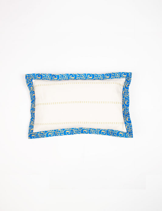 Lumbar cotton cushion cover showcasing intricate threadwork and broad sari edging, made with recycled materials and designed for those who value upcycled clothing, conscious clothing, and circular fashion.