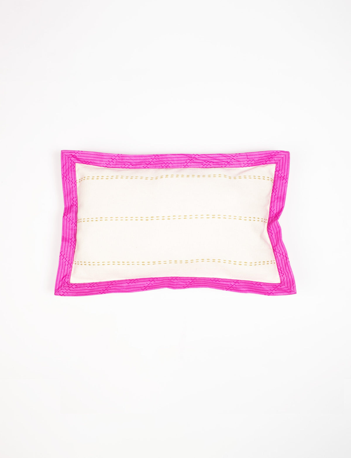Rectangular lumbar cotton cushion cover with cream center, gold dotted stripes, and broad bright pink sari edging, flat lay