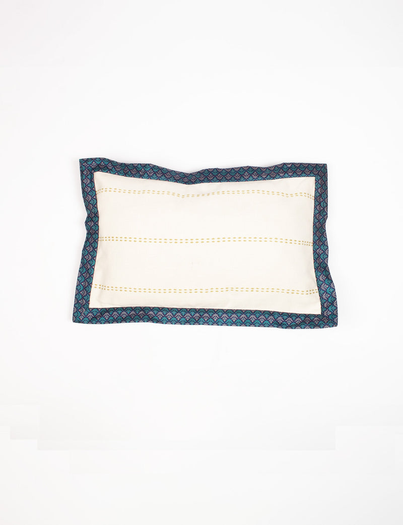 Rectangular lumbar cotton cushion cover with cream center, gold dotted stripes, and broad blue abstract sari edging, flat lay view