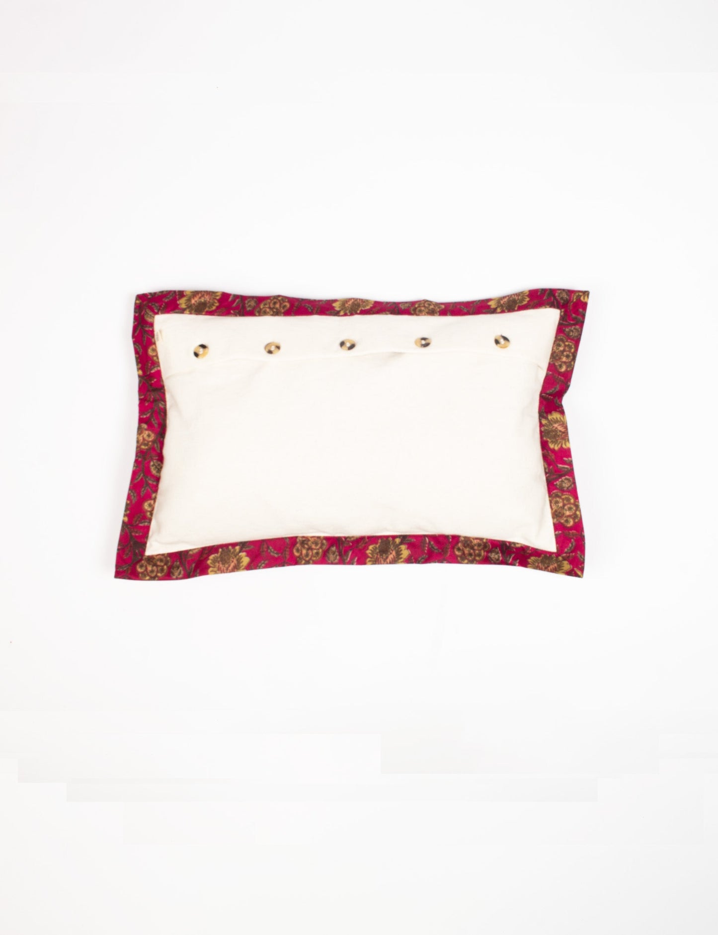 Lumbar cotton cushion cover showcasing intricate threadwork and broad sari edging, made with recycled materials and designed for those who value upcycled clothing, conscious clothing, and circular fashion.