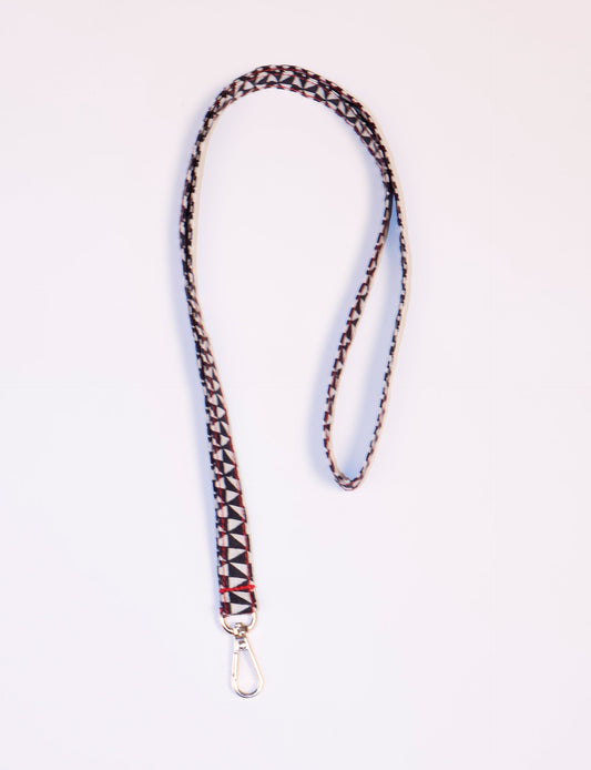 Mobile Phone Lanyard made from recycled sari fabric, featuring repurposed clothing design. Ethical fashion piece promoting eco-friendly fashion, fair trade fashion, and upcycling fashion. Handcrafted by skilled artisans, reflecting recycled material clothing and environmentally friendly clothing trends.