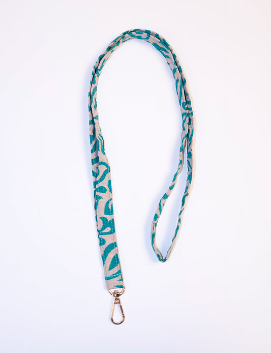 Mobile Phone Lanyard made from recycled sari fabric, featuring repurposed clothing design. Ethical fashion piece promoting eco-friendly fashion, fair trade fashion, and upcycling fashion. Handcrafted by skilled artisans, reflecting recycled material clothing and environmentally friendly clothing trends.