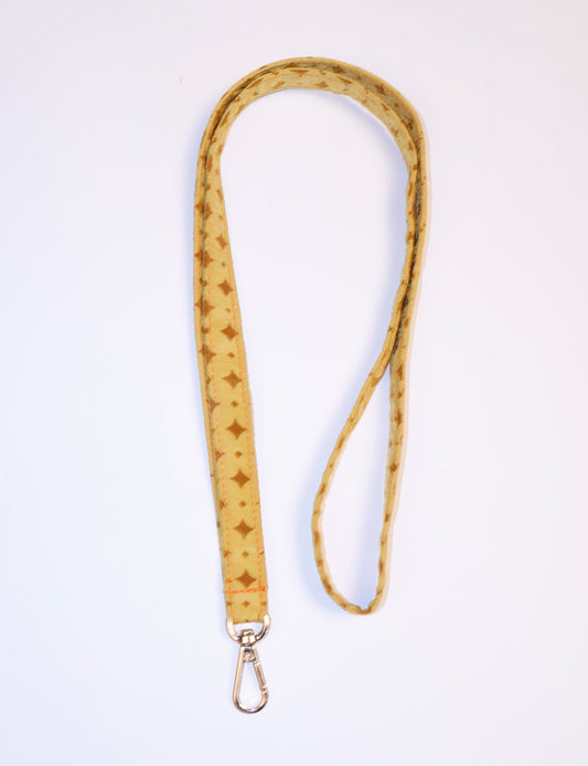 Mobile Phone Lanyard made from recycled sari fabric, featuring repurposed clothing design. Ethical fashion piece promoting eco-friendly fashion, fair trade fashion, and upcycling fashion. Handcrafted by skilled artisans, reflecting recycled material clothing and environmentally friendly clothing trends.