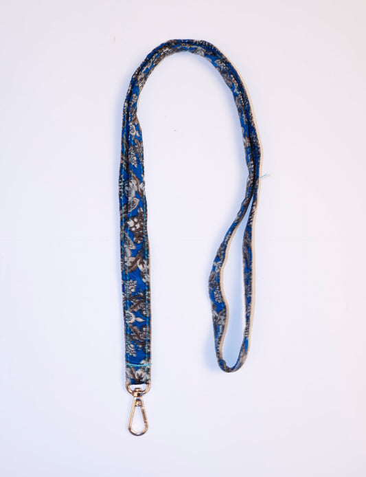 Mobile Phone Lanyard made from recycled sari fabric, featuring repurposed clothing design. Ethical fashion piece promoting eco-friendly fashion, fair trade fashion, and upcycling fashion. Handcrafted by skilled artisans, reflecting recycled material clothing and environmentally friendly clothing trends.