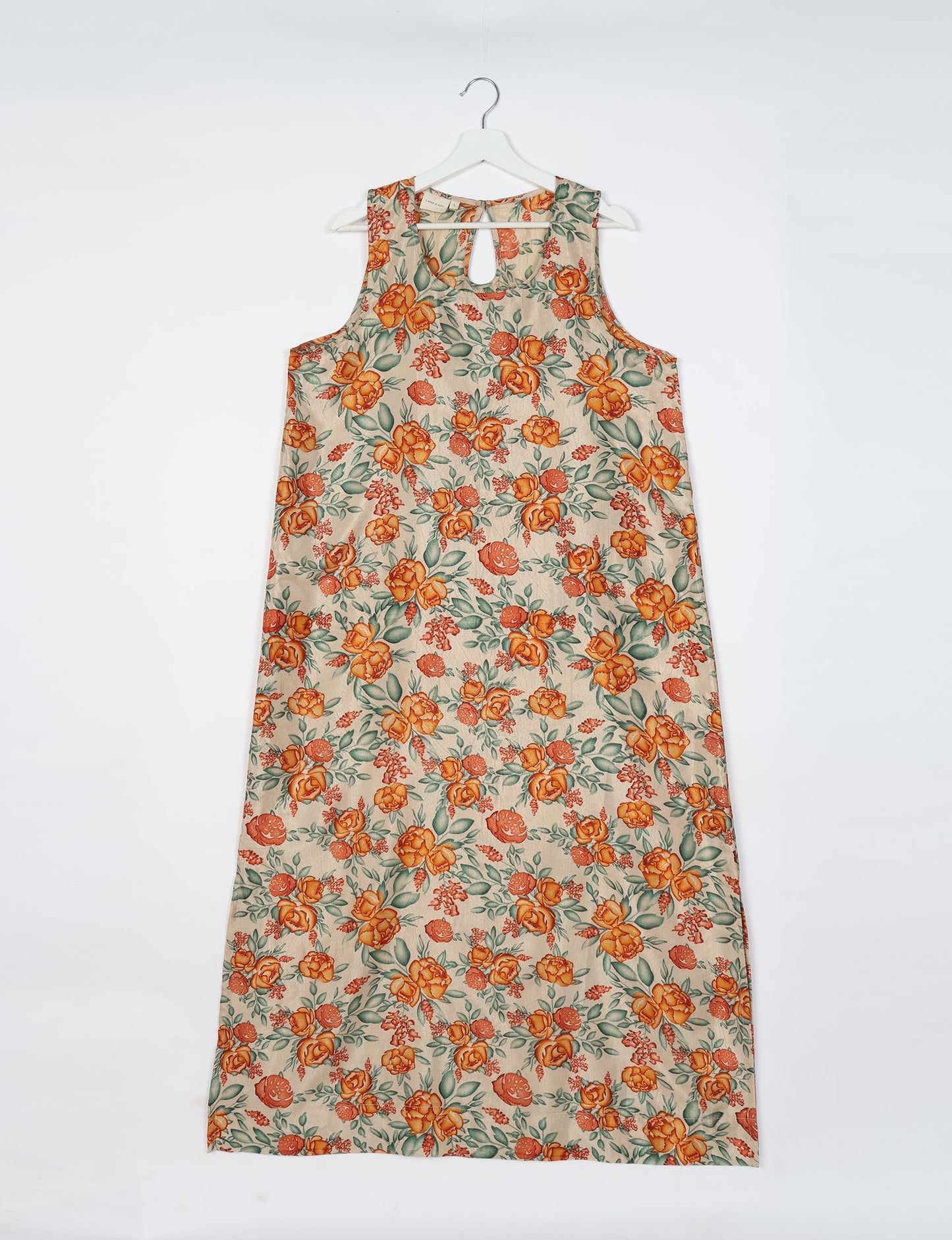 Sleeveless A-Line maxi dress made from recycled saris, showcasing eco clothing and green fashion. A chic example of upcycled women's clothing and climate neutral clothing, perfect for fans of circular fashion, carbon neutral fashion, and products made from textile waste.