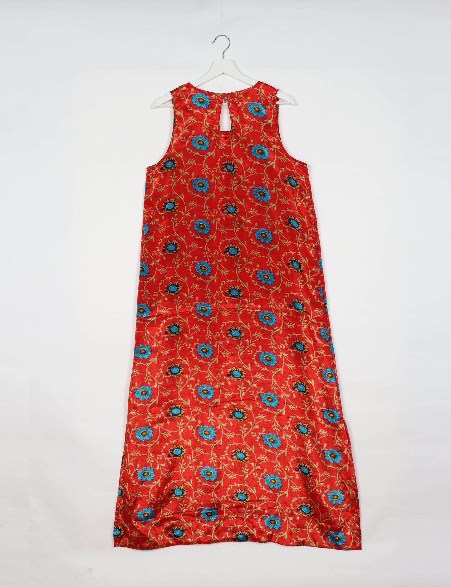 Sleeveless A-Line maxi dress made from recycled saris, showcasing eco clothing and green fashion. A chic example of upcycled women's clothing and climate neutral clothing, perfect for fans of circular fashion, carbon neutral fashion, and products made from textile waste.