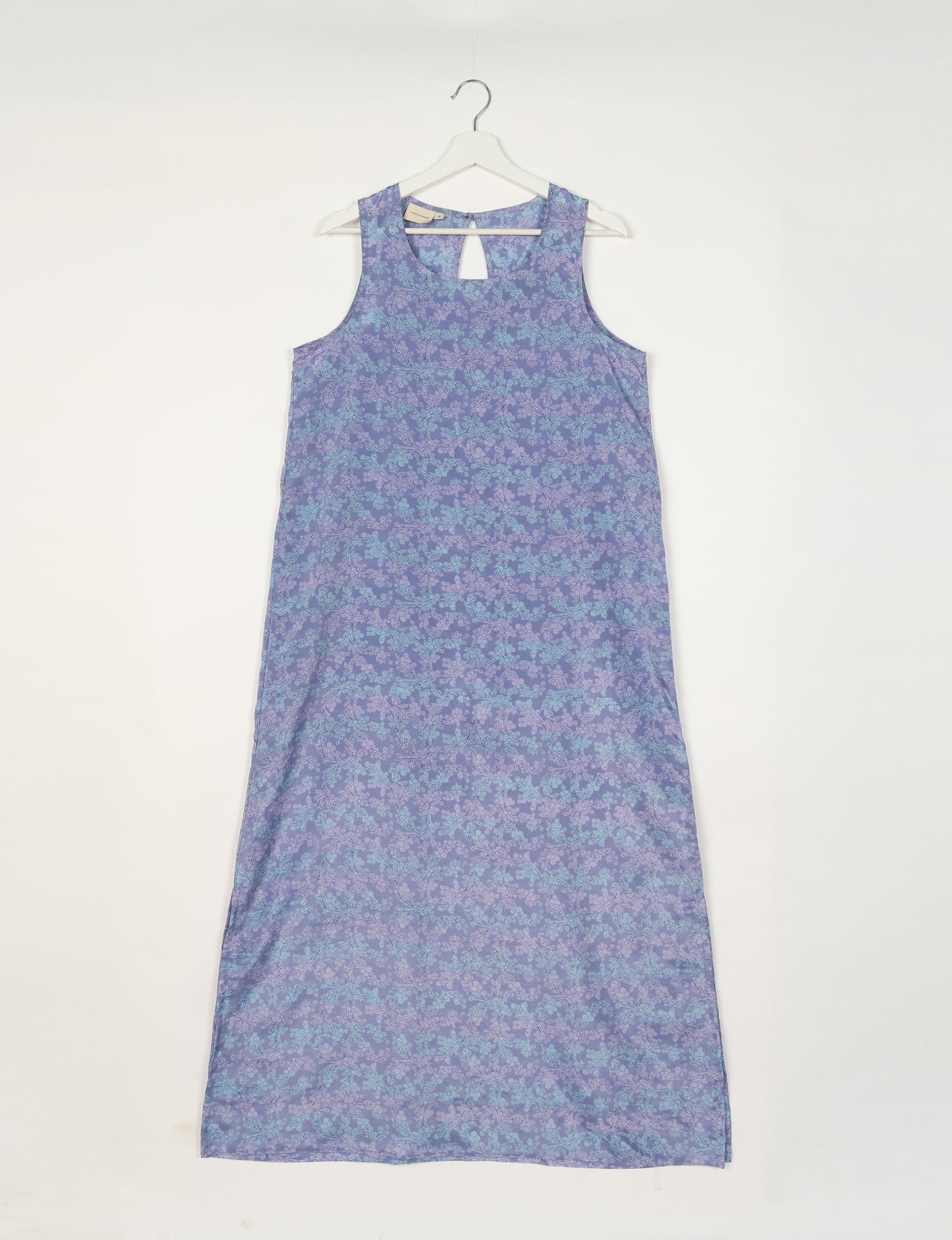 Sleeveless A-Line maxi dress made from recycled saris, showcasing eco clothing and green fashion. A chic example of upcycled women's clothing and climate neutral clothing, perfect for fans of circular fashion, carbon neutral fashion, and products made from textile waste.