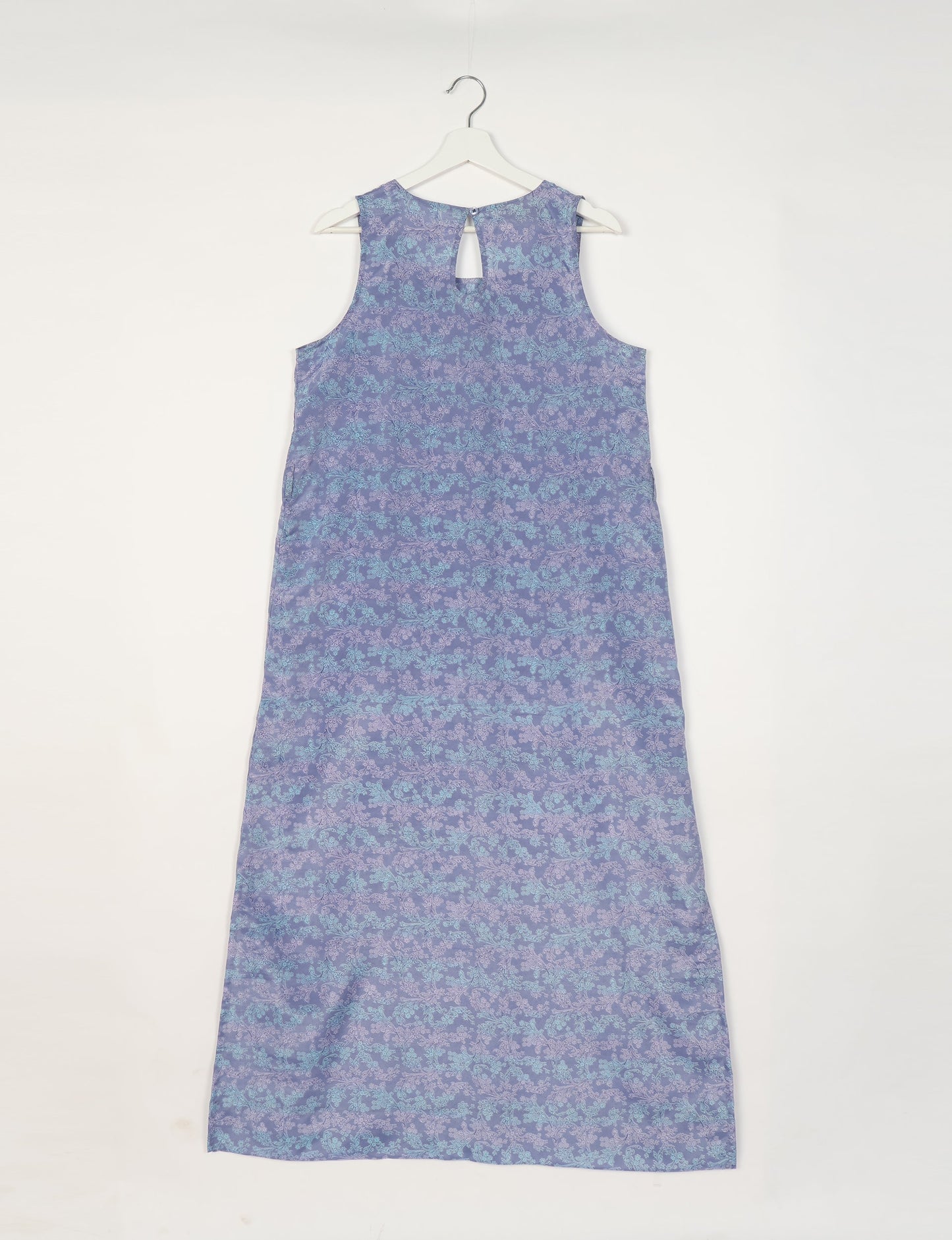 Sleeveless A-Line maxi dress made from recycled saris, showcasing eco clothing and green fashion. A chic example of upcycled women's clothing and climate neutral clothing, perfect for fans of circular fashion, carbon neutral fashion, and products made from textile waste.