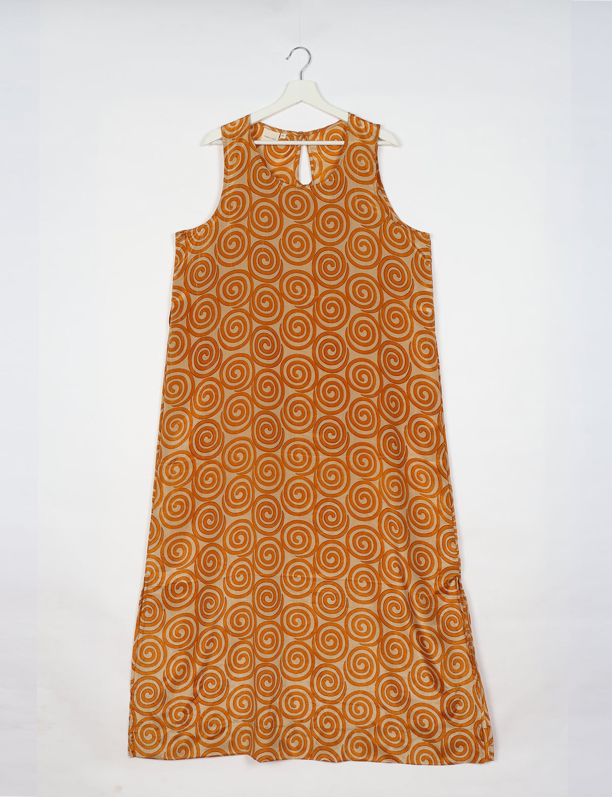 Sleeveless A-Line maxi dress made from recycled saris, showcasing eco clothing and green fashion. A chic example of upcycled women's clothing and climate neutral clothing, perfect for fans of circular fashion, carbon neutral fashion, and products made from textile waste.